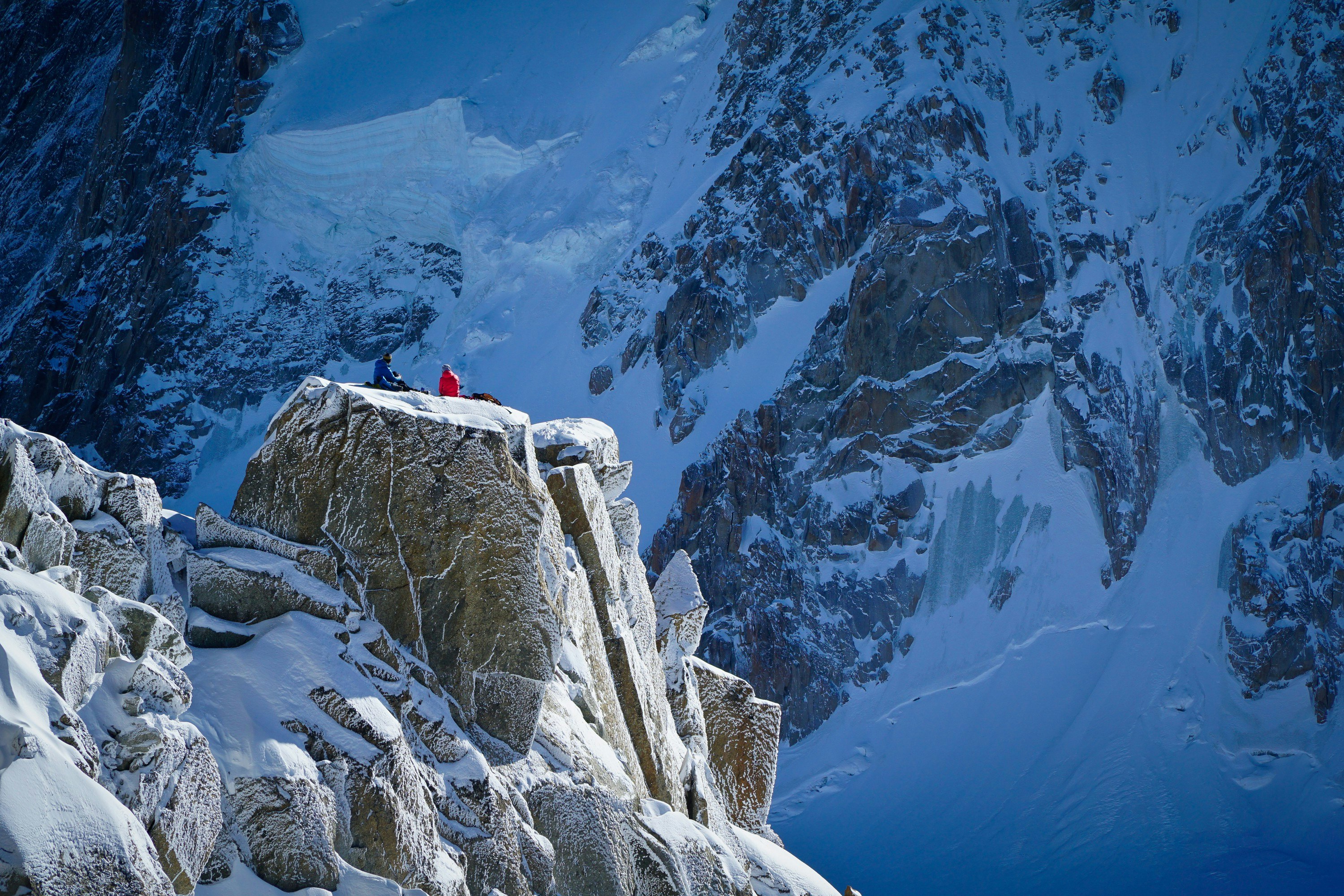 person standing on top of snowy mountain